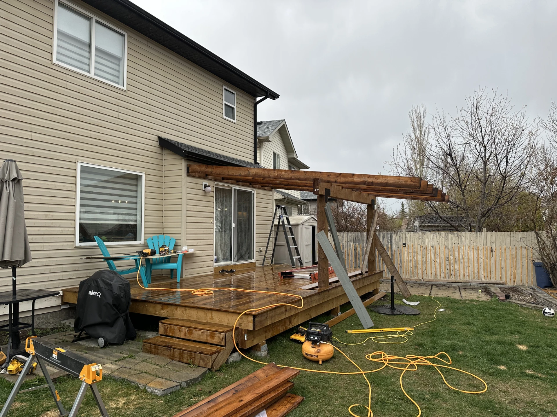 Backyard deck with pergola under construction