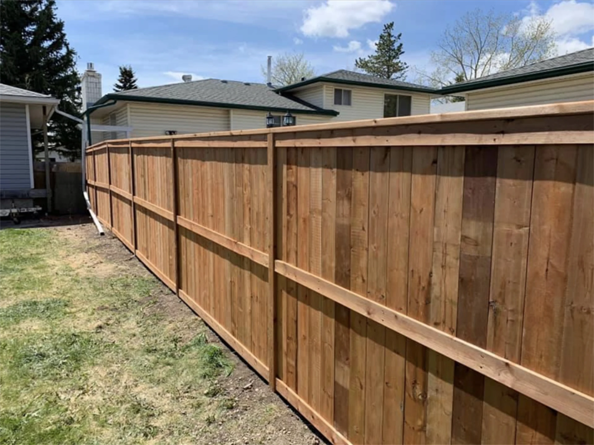 Long cedar backyard privacy fence