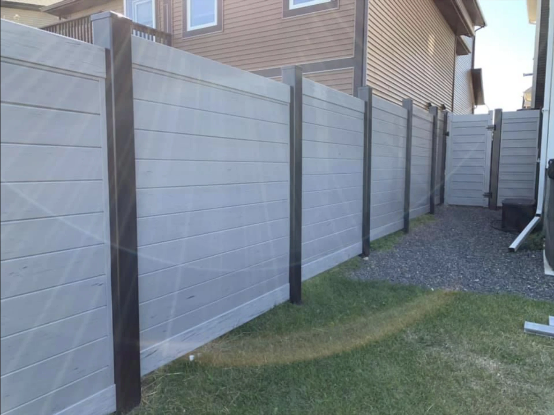 Modern gray composite privacy fence