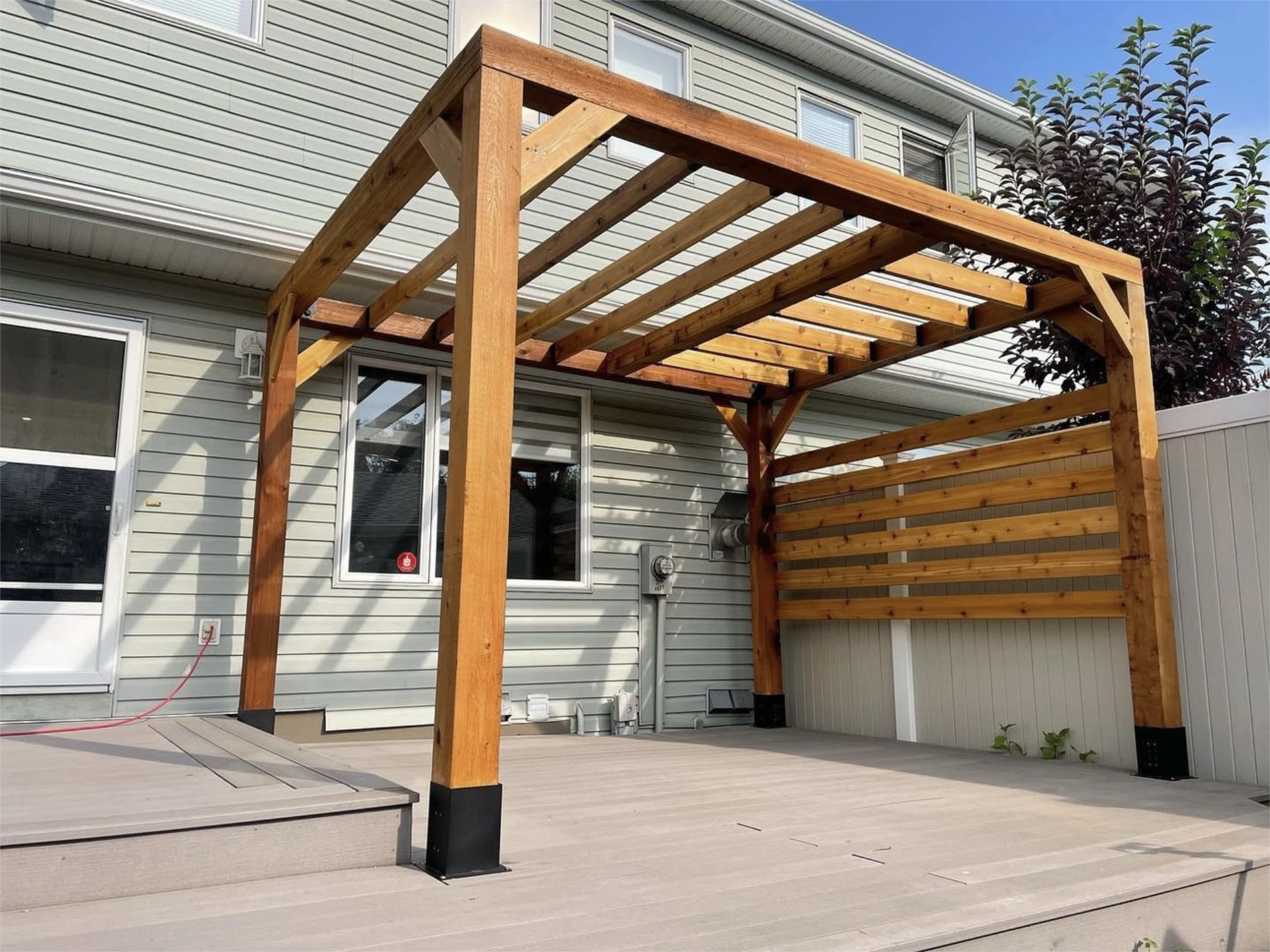 Wood pergola on raised backyard deck