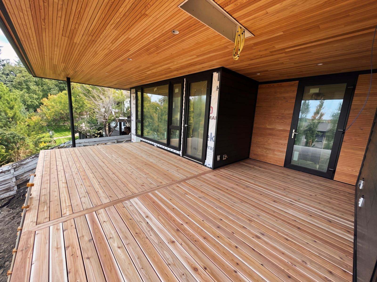 Cedar deck boards and covered porch built in Calgary, AB