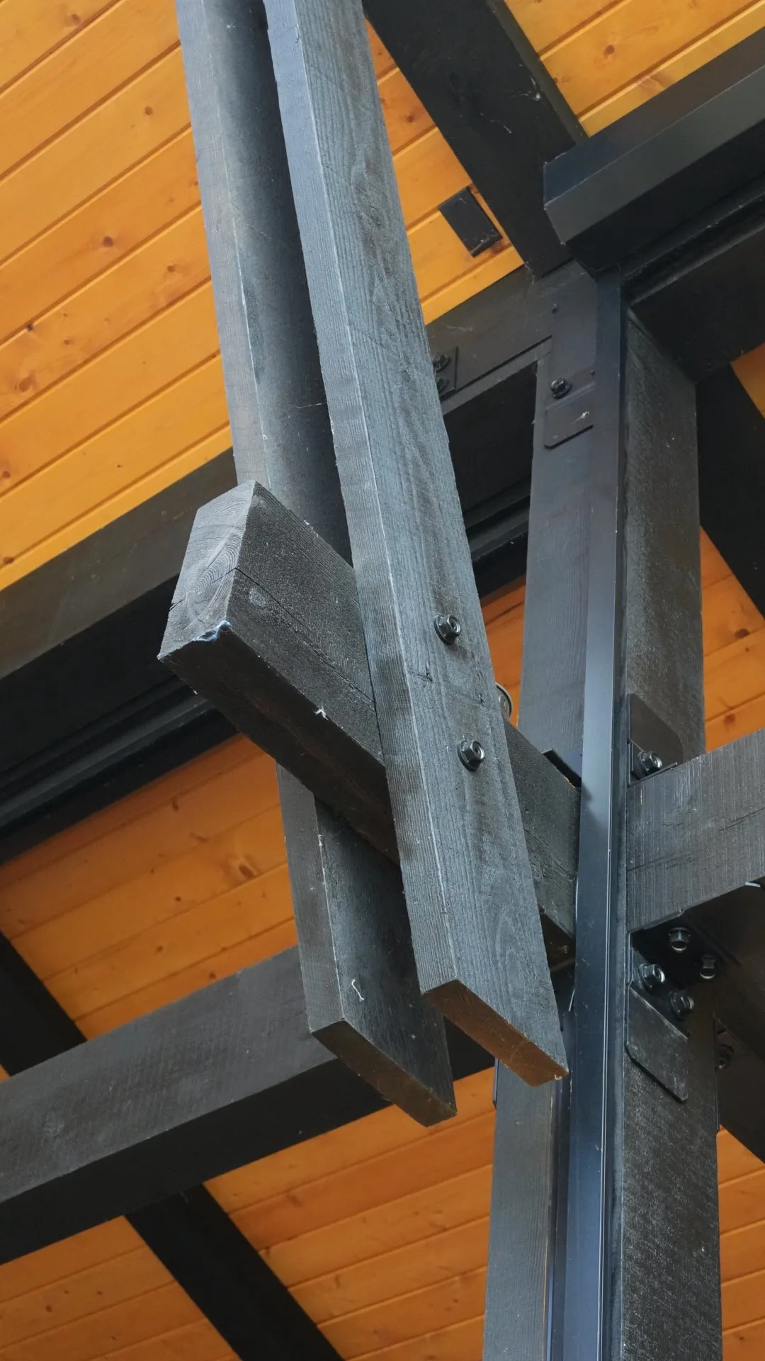 Bolted timber and steel beam connection on a covered deck roof in Calgary, AB