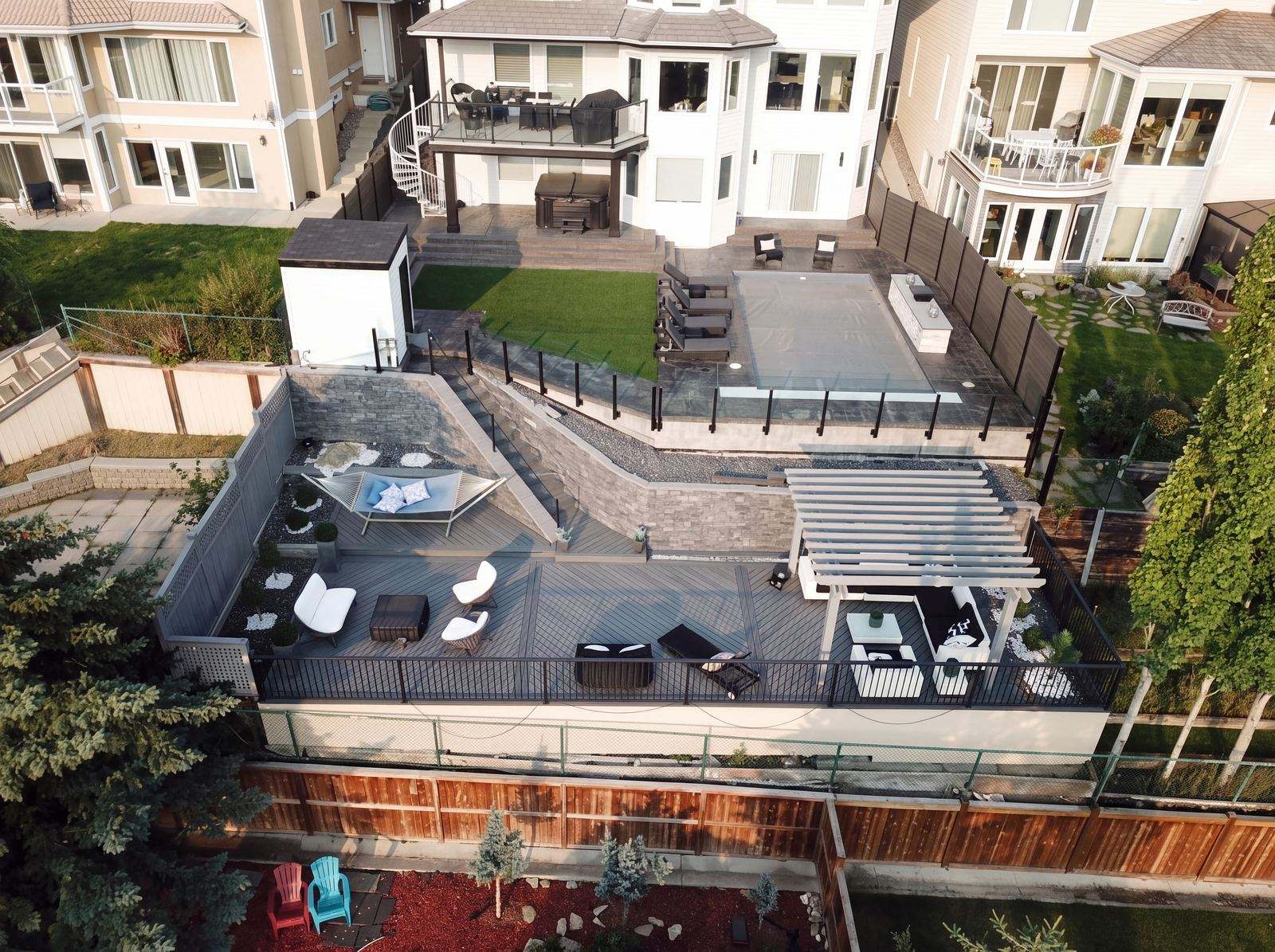 Aerial view of a composite deck, pergola and landscaped backyard in Calgary, AB