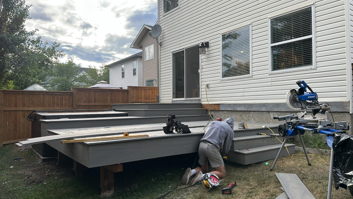 Gray deck installation on the big house
