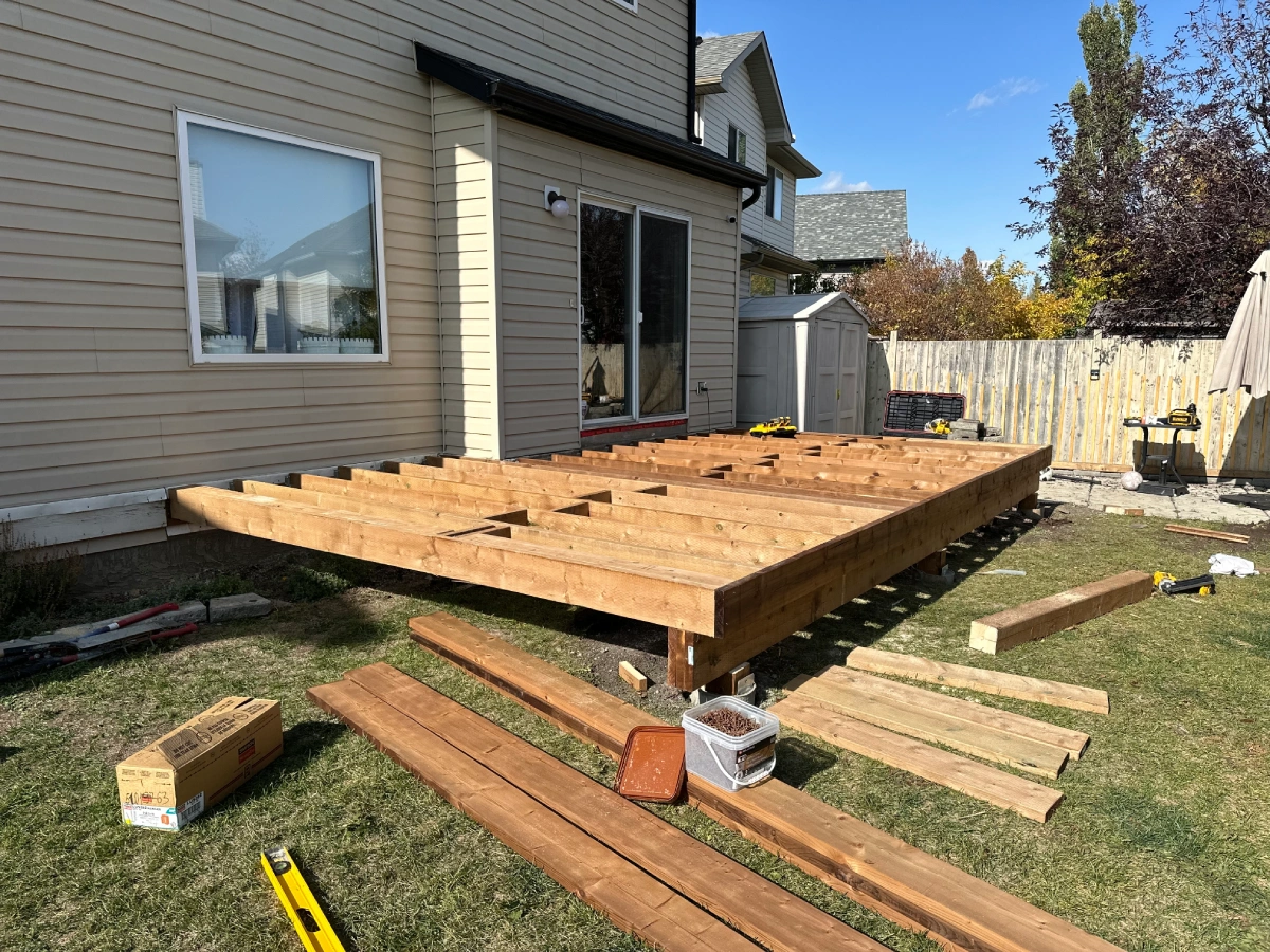 Pressure treated lumber deck framing under installation