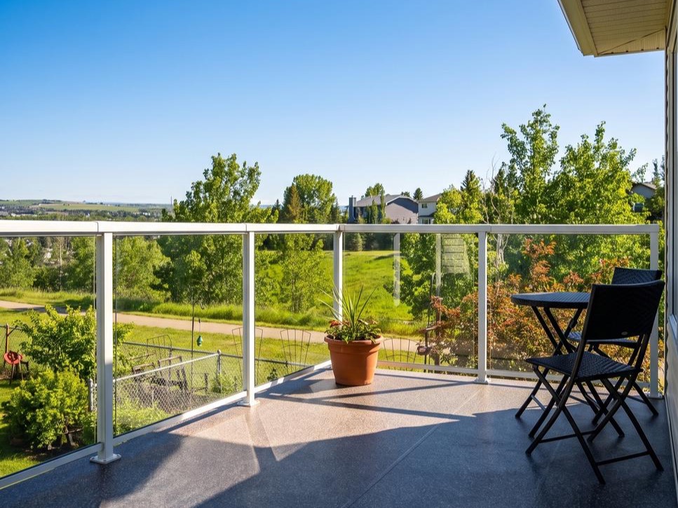 Charcoal speckled vinyl deck membrane on a balcony overlooking a valley in Calgary, AB